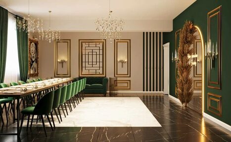 Арендовать Голливуд. Элегантный лофт в зелено-бежевых оттенках. Просторное помещение с длинным обеденным столом, окруженным зелеными стульями. Потолочные люстры, темные пол и стены, акцентная стена зеленого цвета с золотыми рамами. На полу ковровая вставка светлого цвета. Декоративные зеркала.