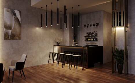 Арендовать Лофт Мираж. Современный интерьер с барной стойкой, высокими стульями и настенными полками для напитков. Потолочные светильники, общее освещение приглушённое. Стены и пол отделаны в нейтральных тонах, на стене картина и декоративная надпись "МИРАЖ".