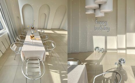 Арендовать Роскошный панорамный лофт . Панорамные окна, залитые солнечным светом. Стол со стульями. Кровать. Диван с журнальным столиком