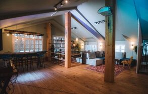 Loft with bar counter and wooden floor