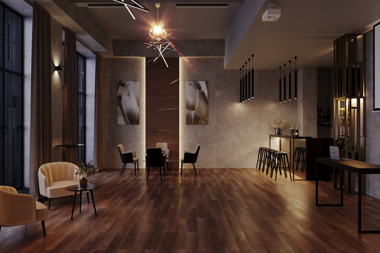 Арендовать Лофт Мираж. Просторное помещение с деревянным полом, высокий потолок. Справа барная стойка с высокими стульями, слева стулья и кресла вокруг столиков. На стенах картины, потолочные светильники различной формы. Потолок серого цвета с проектором.